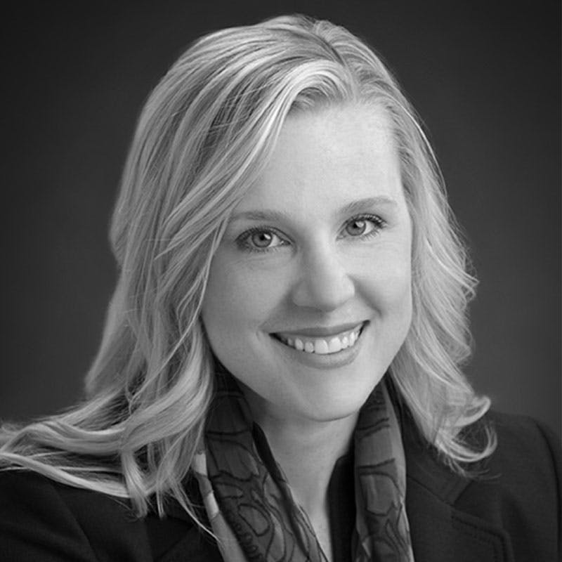 Black and white portrait of StrawberryFrog advisory board member Becky Schmitt.