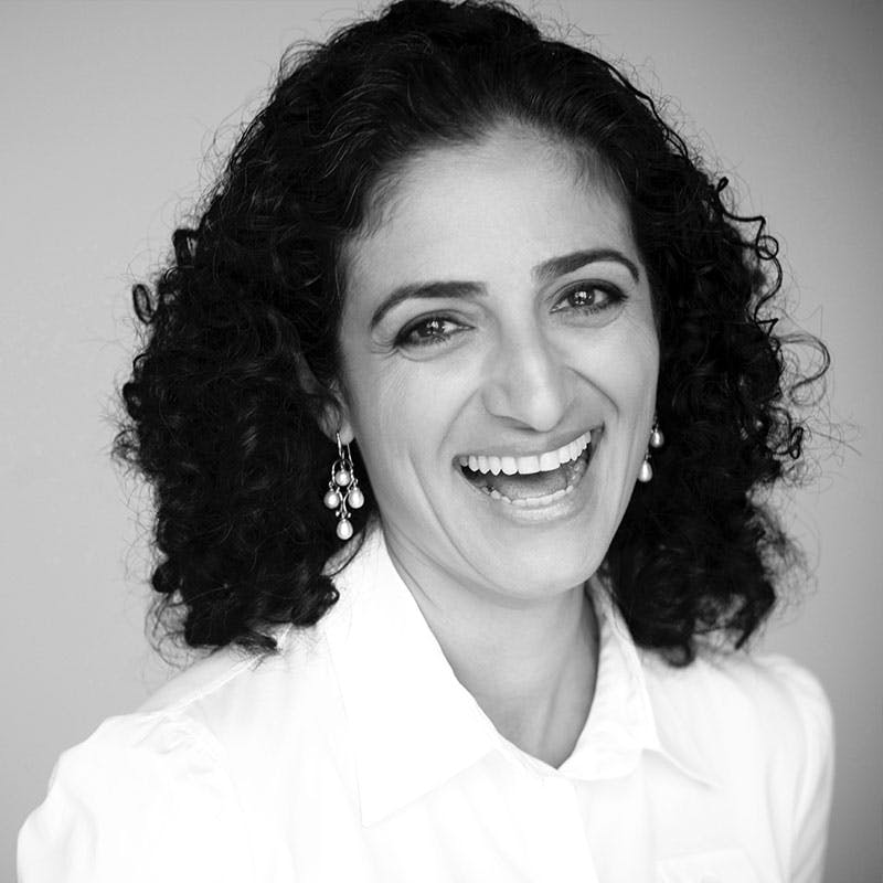 Black and white portrait of StrawberryFrog advisory board member Maryam Banikarim.