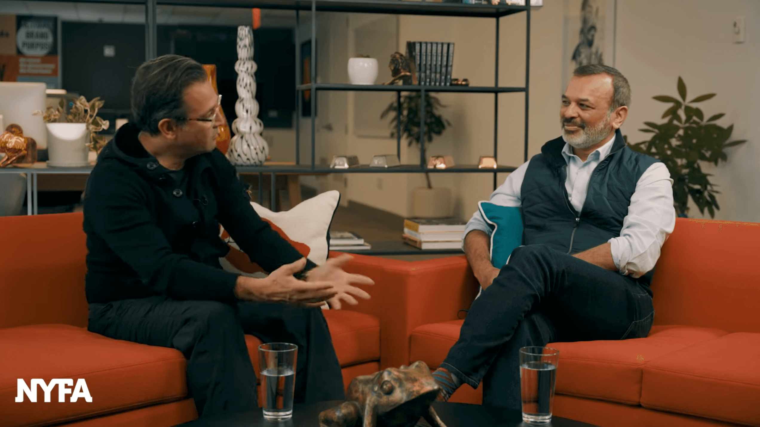 Image of Scott Goodson interviewing Vinoo Vijay on an orange sofa