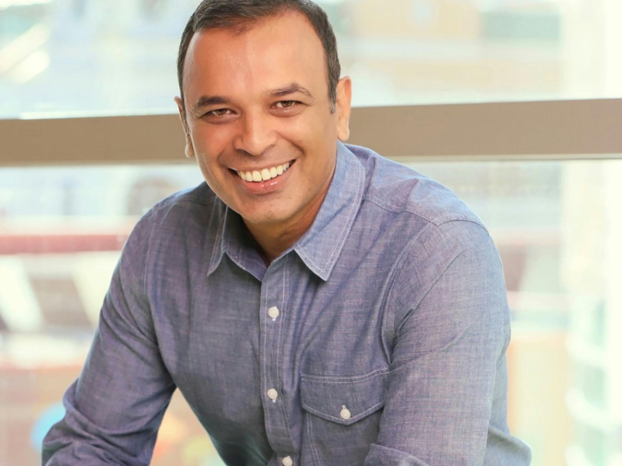 Portrait of a man smiling, Vinoo Vijay, Chief Marketing Officer at Truist