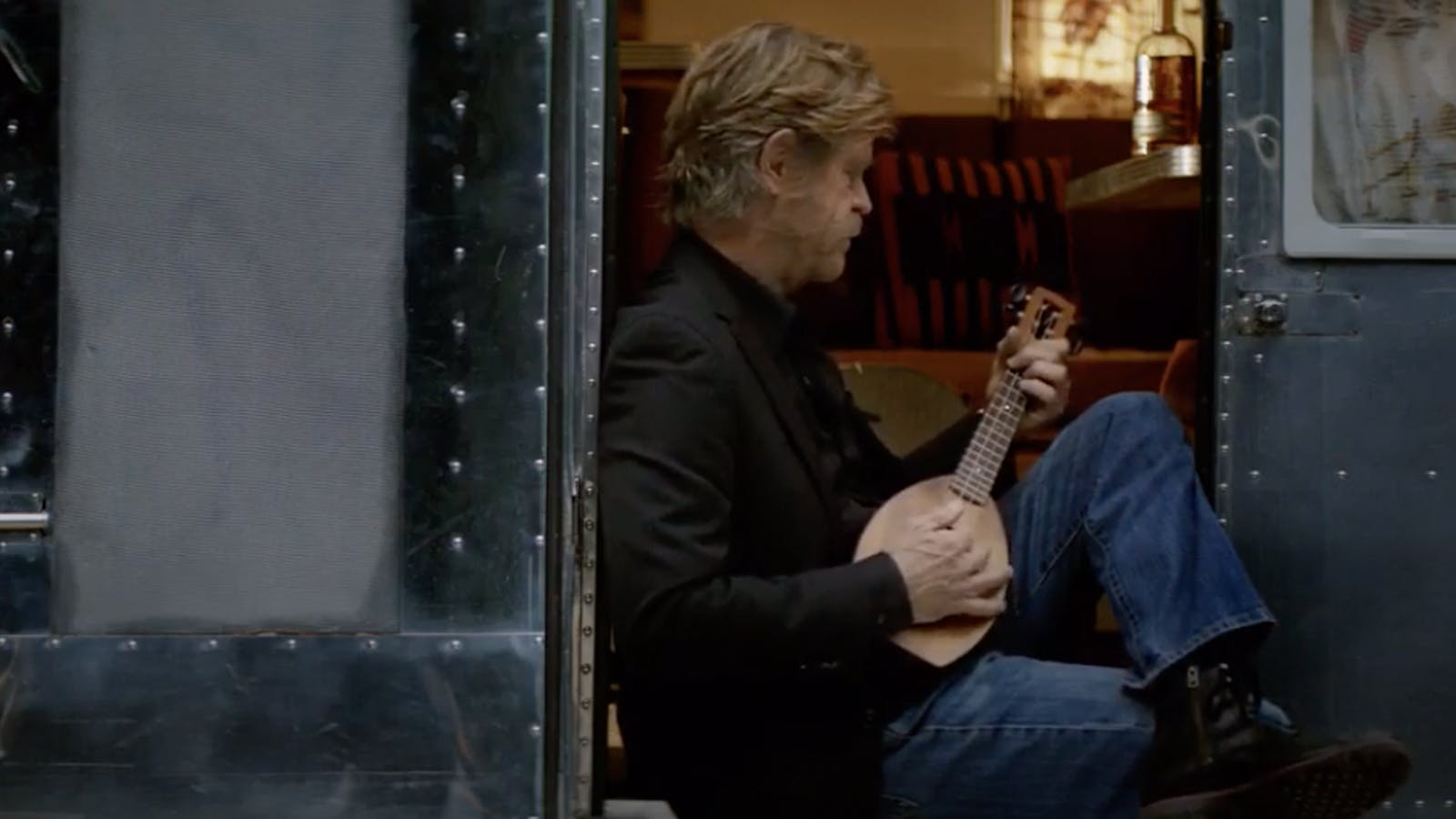 Actor William H. Macy plays the banjo for the Woody Creek campaign.