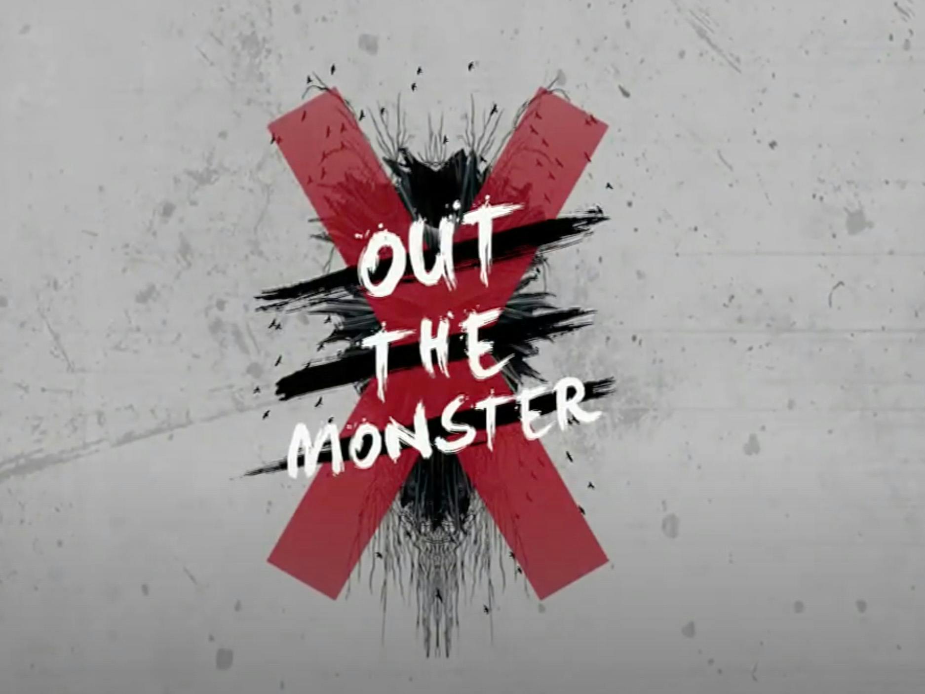 Text that reads “Out the Monster” in white, overlaid on a large, red “X.”