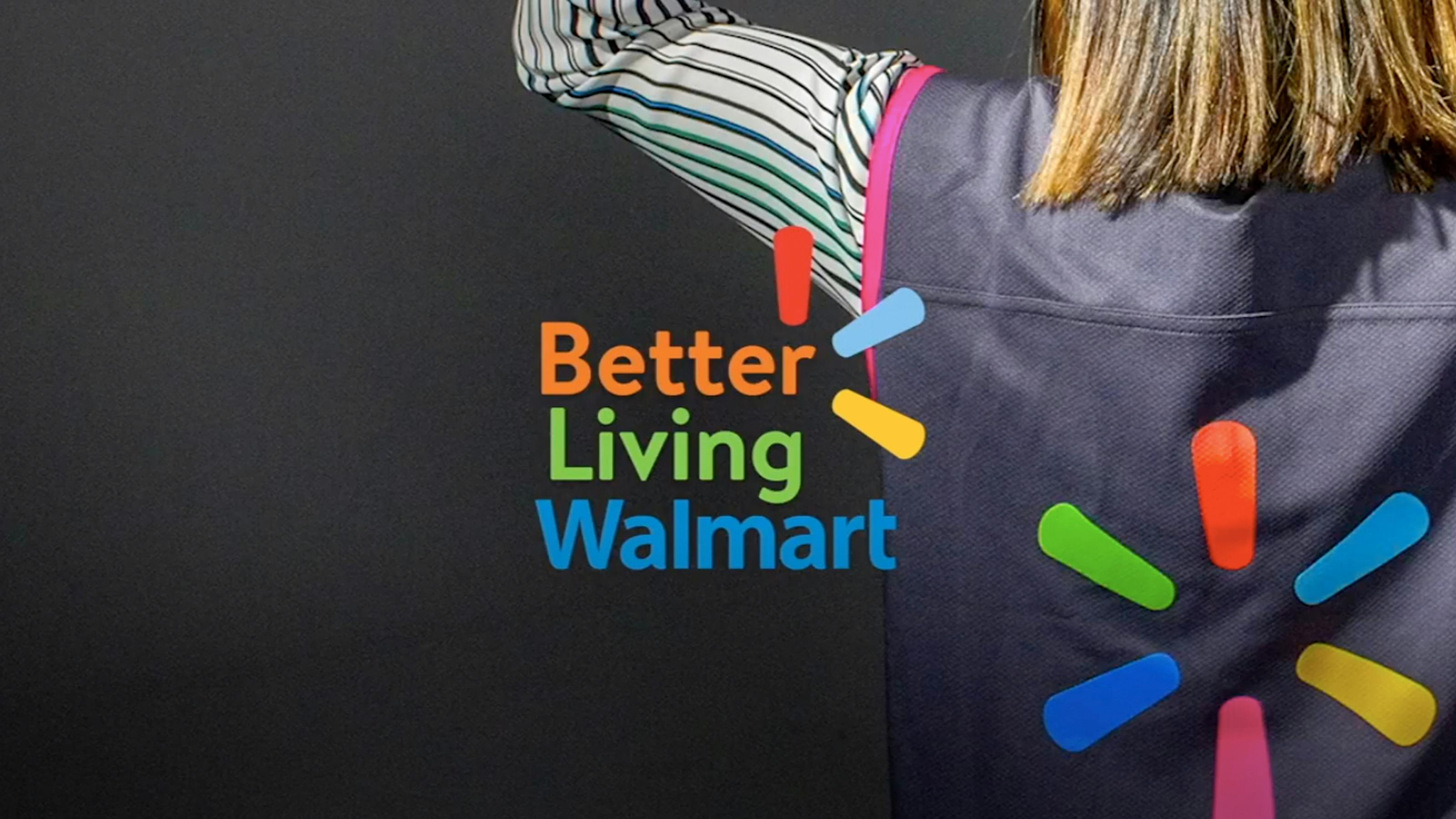 Close-up of a woman’s back. She wears a long sleeve and a vest. The overlaid text reads “Better Living Walmart.”