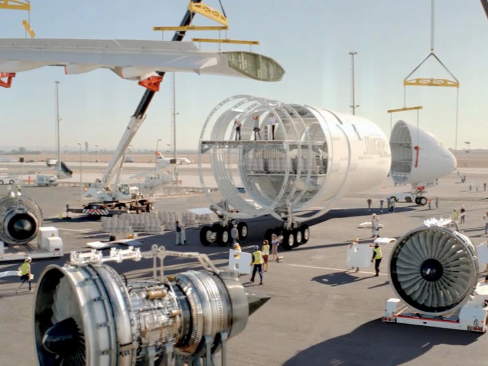 Screengrab of airport ramp agents assembling a large white plane for the Emirates “Hello Tomorrow” case study.